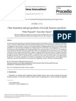 Char Formation and Gas Products of Woody Biomass Pyrolysis