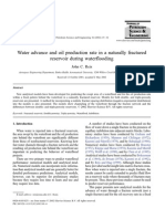 Water advance and oil production rate in a naturally fractured reservoir during waterflooding