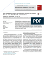 Fluid flow and heat transfer investigations on enhanced microchannel heat sink using oblique fins