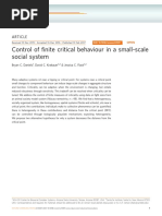 Control of Finite Critical Behaviour in A Small-Scale Social System