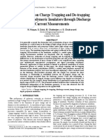 Investigations On Charge Trapping and De-Trapping Properties of Polymeric Insulators Through Discharge Current Measurements