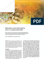 Deformation and the Strip Necking Zone in a Cracked Steel Sheet