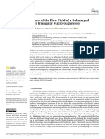 Water: Numerical Simulations of The Flow Field of A Submerged Hydraulic Jump Over Triangular Macroroughnesses