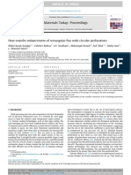 Heat Transfer Enhancement of Rectangular Fins With Circular Perforations