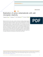 Realization of Active Metamaterials With Odd Micropolar Elasticity