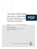 The Role of Wettability Alteration in Subsurface CO Storage: Modeling and Numerical Analysis