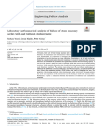 Laboratory and Numerical Analysis of Failure of Stone Masonry Arches With and Without Reinforcement