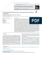 Leveraging Topology For Domain Adaptive Road Segmentation in Satellite and Aerial Imagery