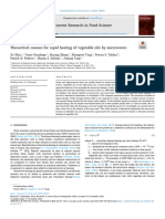 Theoretical reasons for rapid heating of vegetable oils by microwaves