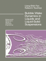 Bubble Wake Dynamics in Liquids and Liquid-Solid Suspensions